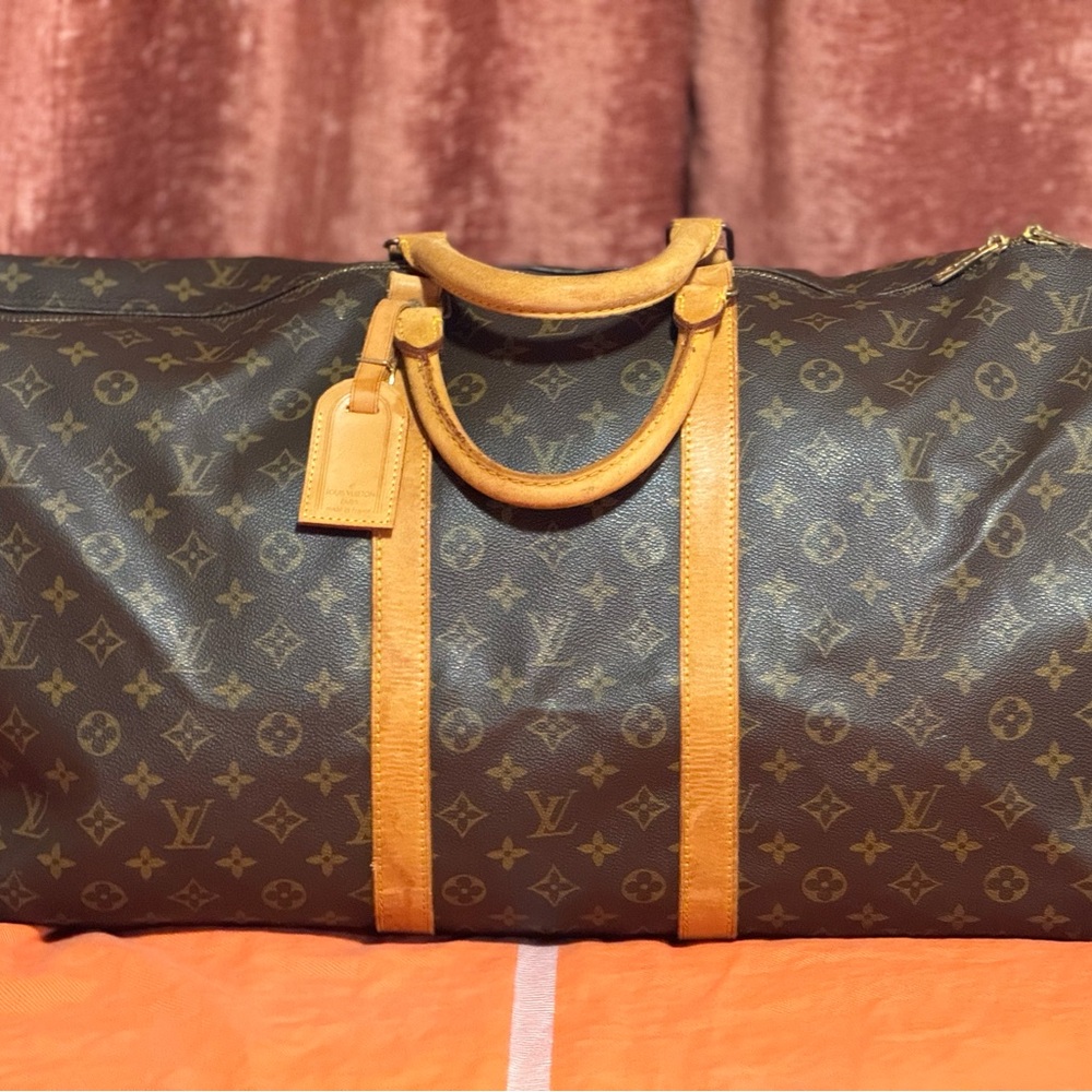 Authenic Louis Vuitton 55 duffle bad with travel tag